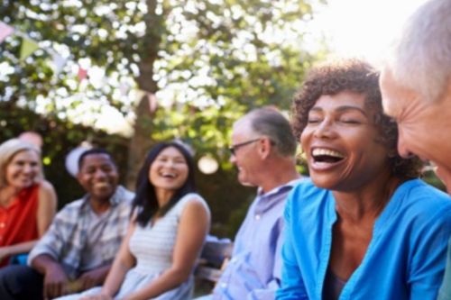 post covide header image of smiling people Group of people smiling in the sunshine